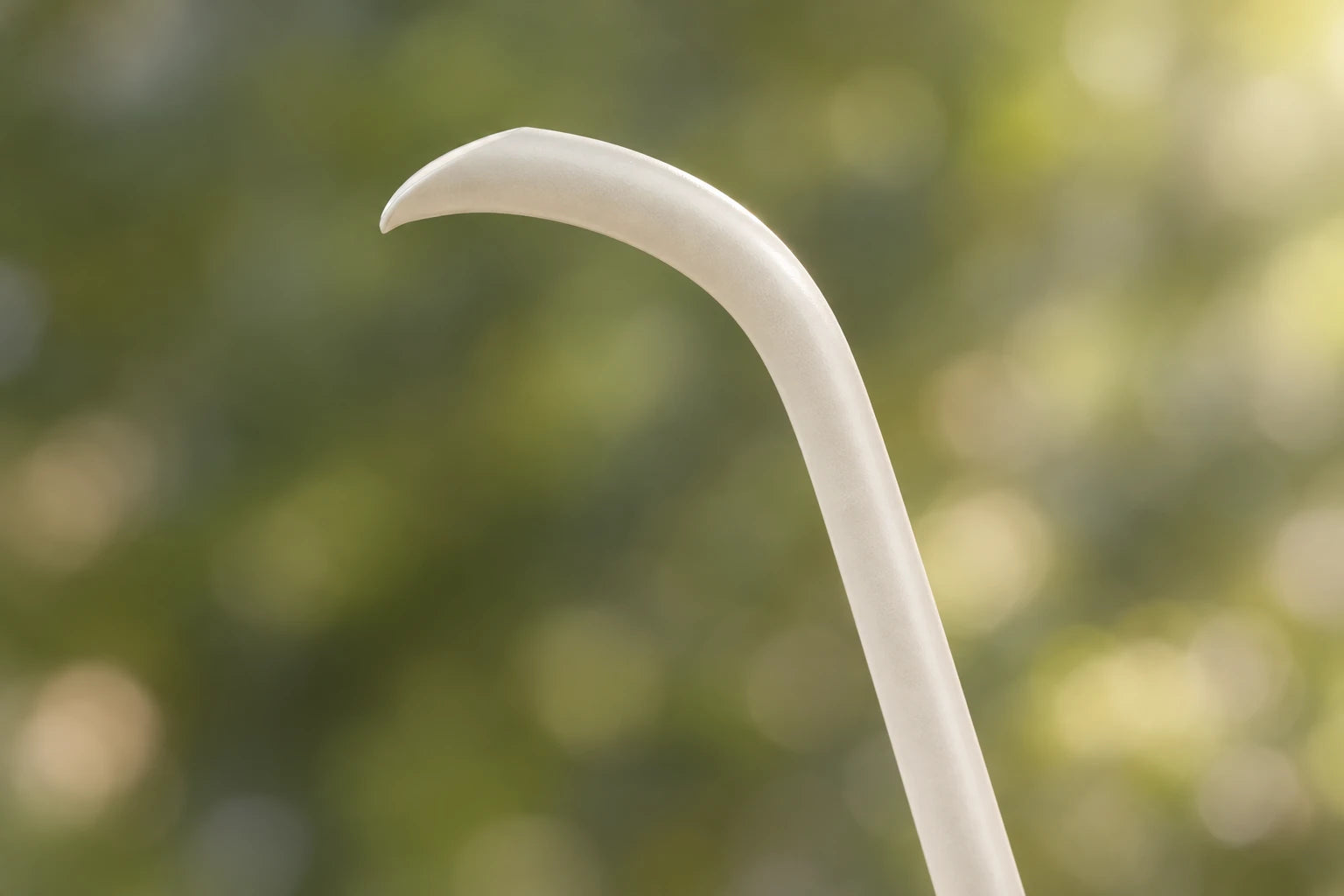 A side detail of the slender Cream White EPEIOS gooseneck spout