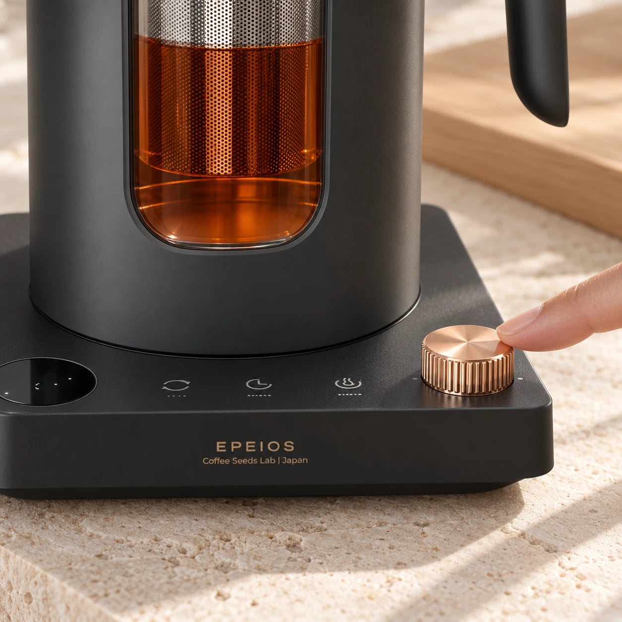 A fingertip adjusting the tea kettle copper temperature dial